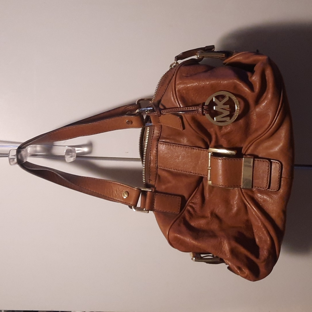Michael kors hand bag. 14 in long. Color brown